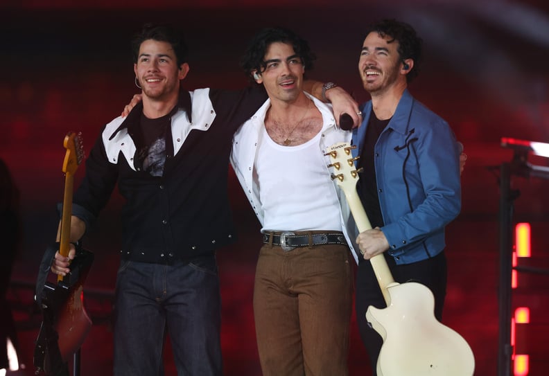ARLINGTON, TEXAS - NOVEMBER 24: Nick Jonas, Joe Jonas, and Kevin Jonas of the Jonas Brothers perform in the halftime show during the game between the Dallas Cowboys and the New York Giants at AT&T Stadium on November 24, 2022 in Arlington, Texas. (Photo b