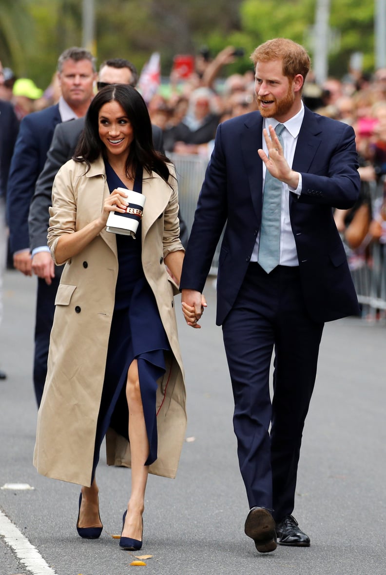 Meghan Outfitted Her Dion Lee Dress With Manolo Blahnik Pumps, a Gucci Handbag, and a Martin Grant Trench
