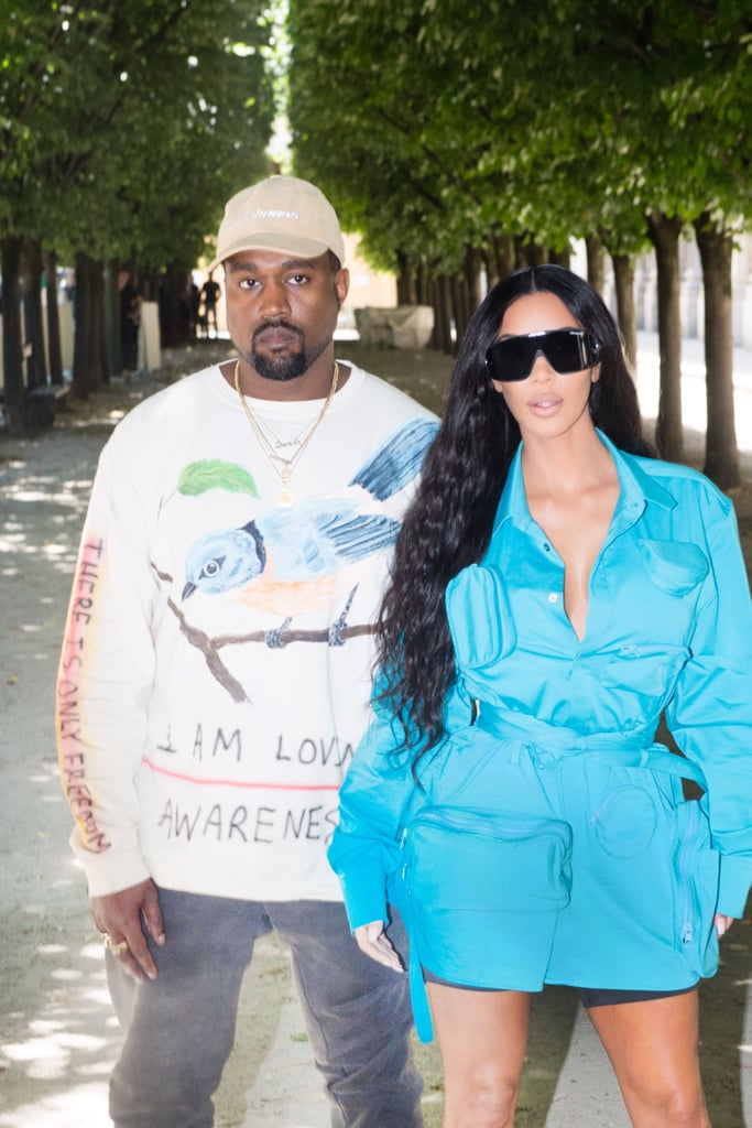 Kanye West leaving his office in a red and blue checkered jacket and  carrying a large Louis Vuitton luggage bag Featuring: Kany Stock Photo -  Alamy