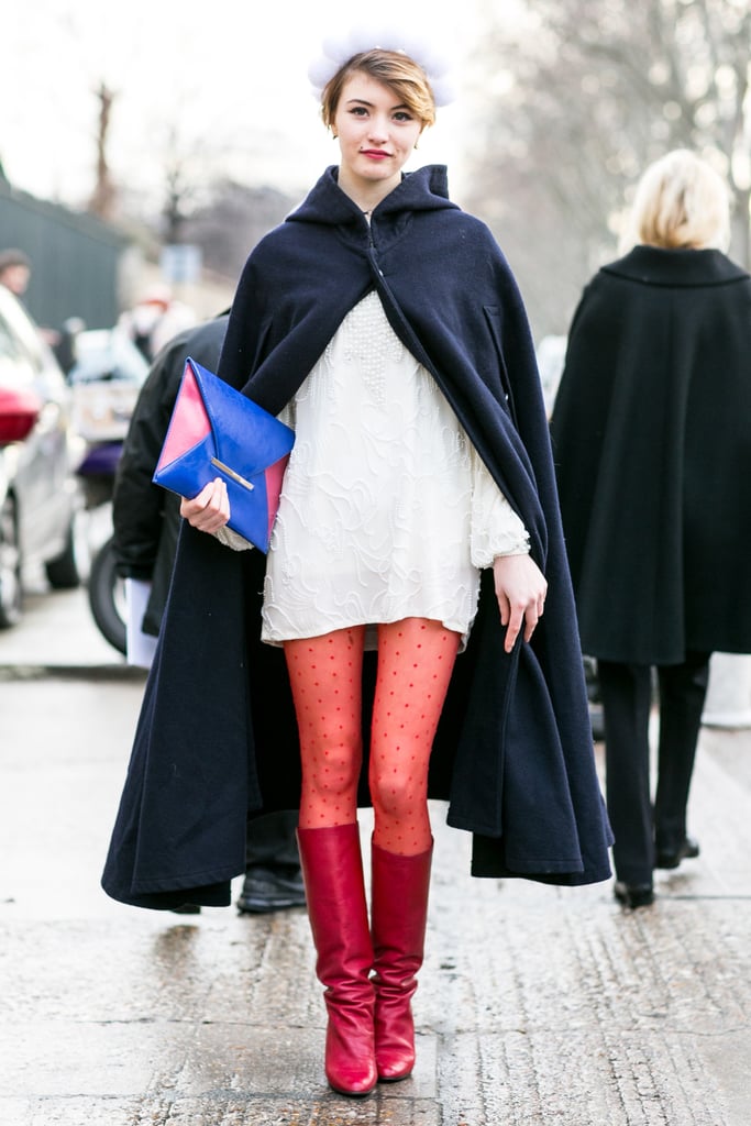 Like the modern Little Red Riding Hood — but, well, with red tights and a navy cape.