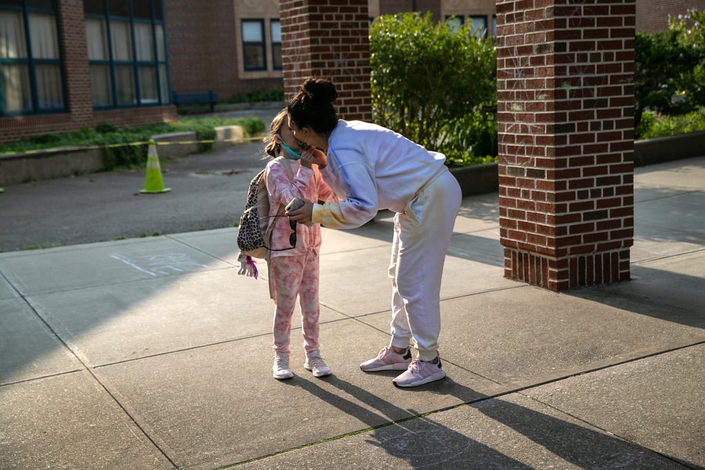 A mother kissed her daughter goodbye while dropping her off at Stark Elementary School in Connecticut for in-person learning in September.