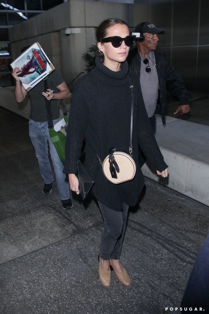 Wearing a Black Turtleneck, Gray Jeans, and a Pair of Beige Mules