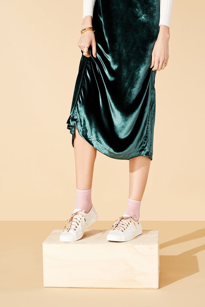Who says an elegant ensemble can't also be functional? Featuring rich emerald and luxe velvet, this look can effortlessly take you from desk to dinner (and beyond) without skipping a beat. Highlight these versatile yet not-so-basic white sneakers by slipping into complementary socks that are meant for showing off.
Kickstart Meadow Sneakers ($70)