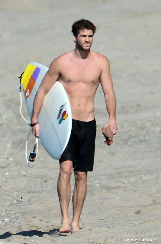 Liam Hemsworth carried his surfboard on the beach in Costa Rica in January 2013.
Liam Hemsworth carried his surfboard on the beach in Costa Rica in January 2013.
