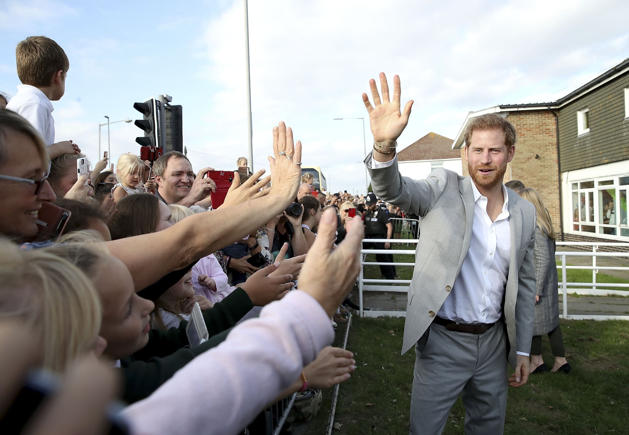 PEACEHAVEN, UNITED KINGDOM - OCTOBER 03:  Prince Harry, Duke of Sussex waves to locals on an official visit to the Joff Youth Centre in Peacehaven, Sussex on October 3, 2018 in Peacehaven, United Kingdom. The Duke and Duchess married on May 19th 2018 in Windsor and were conferred The Duke & Duchess of Sussex by The Queen.  (Photo by Chris Jackson/Getty Images)