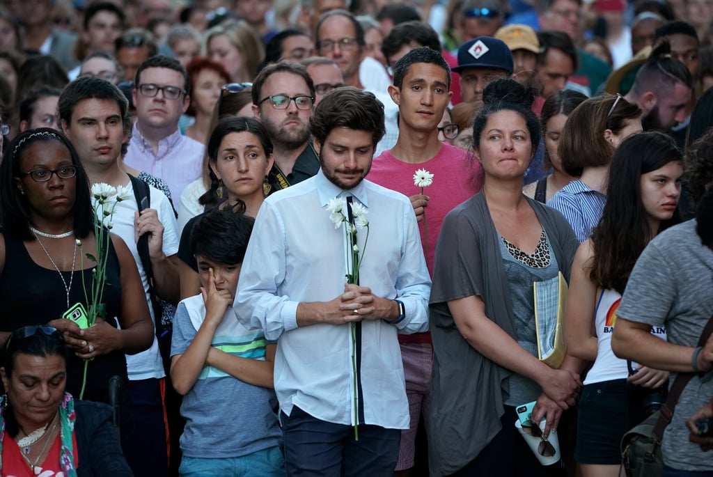 A crowd gathered at the site of the car crash.