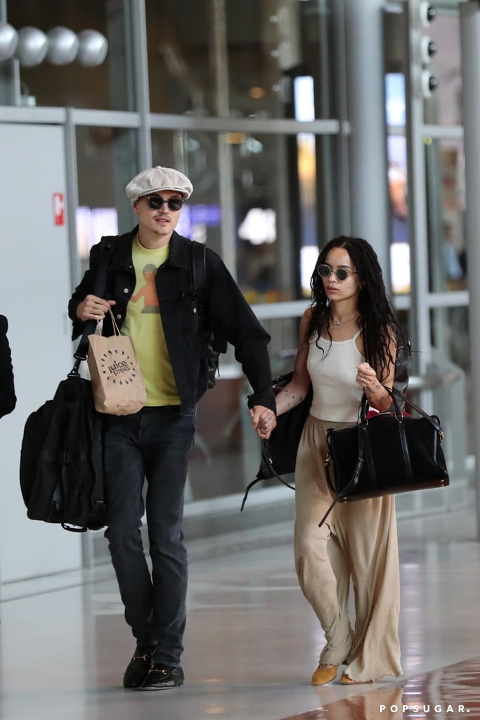 Her airport style is laidback too. Here she is with her husband Karl waring a white crop top paired with breezy beige pants while in France.