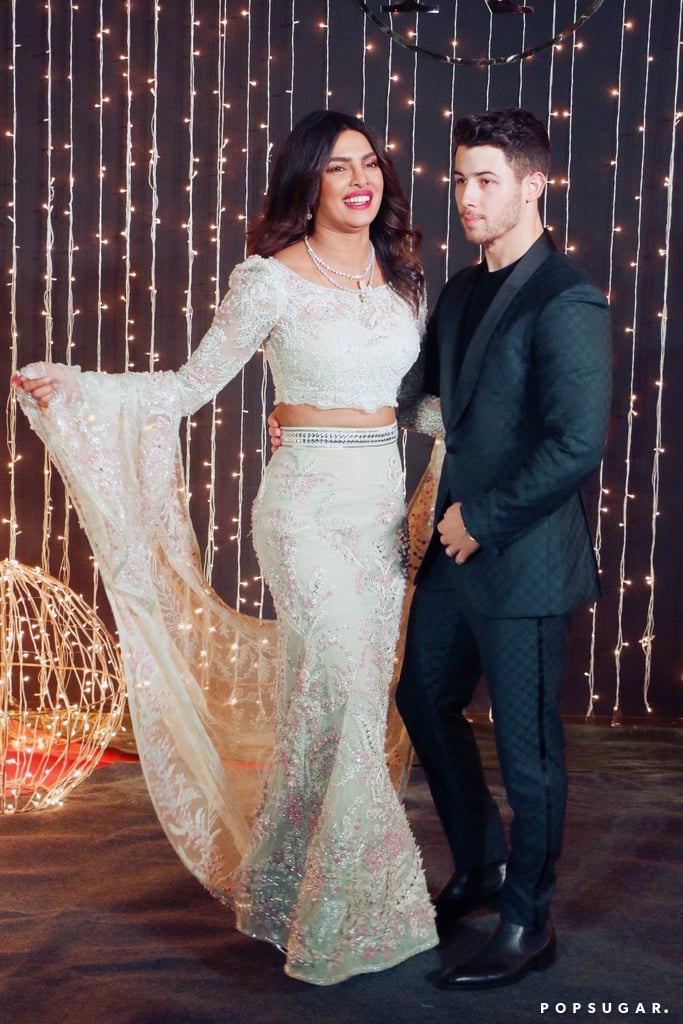 For their third ceremony in Mumbai, Priyanka wore a crop top and skirt by Abu Jani Sandeep Khosla, which featured intricate floral stitching from top to bottom.