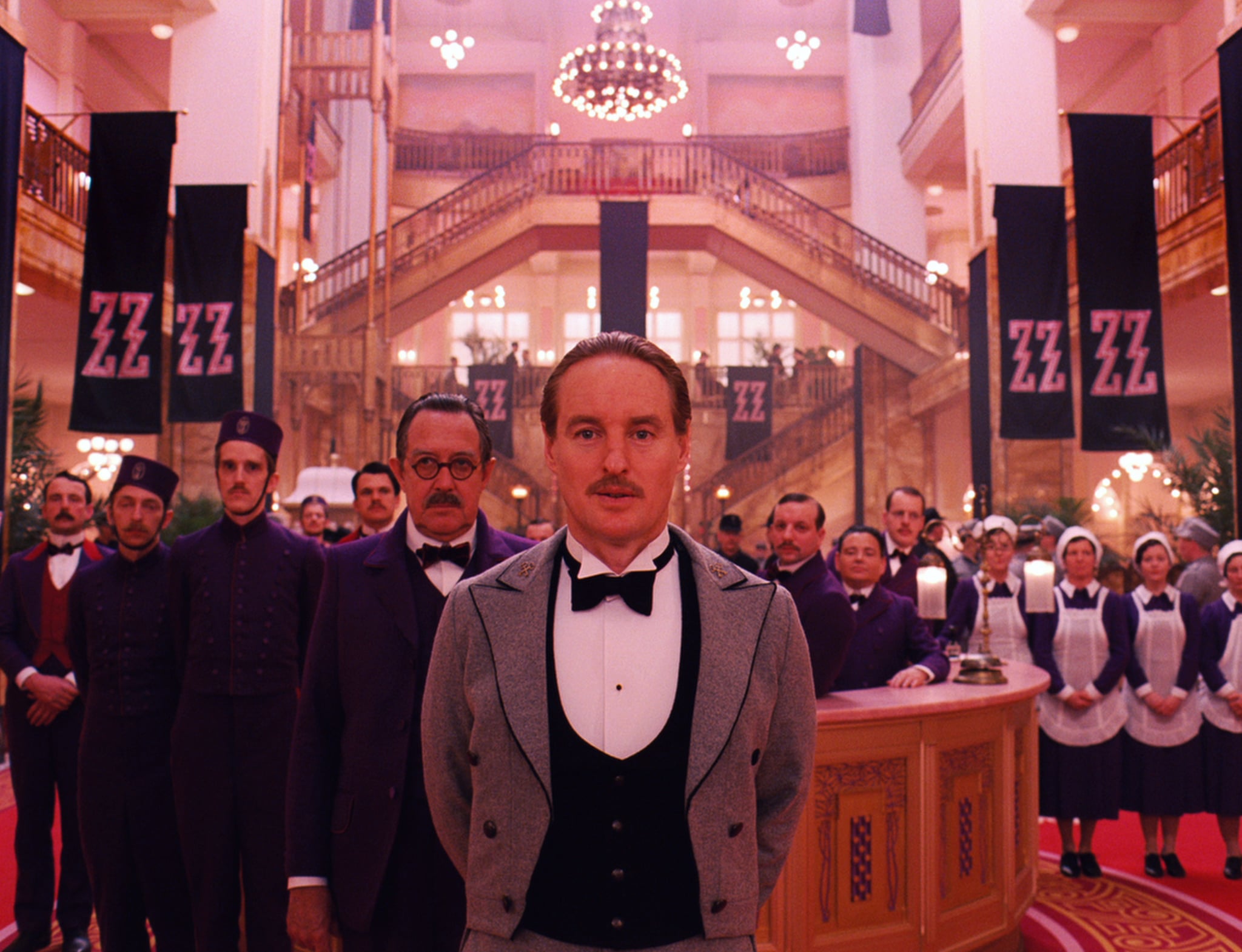 THE GRAND BUDAPEST HOTEL, Tom Wilkinson (left of center), Owen Wilson (front), 2014. /TM and Copyright Fox Searchlight Pictures/courtesy Everett Collection