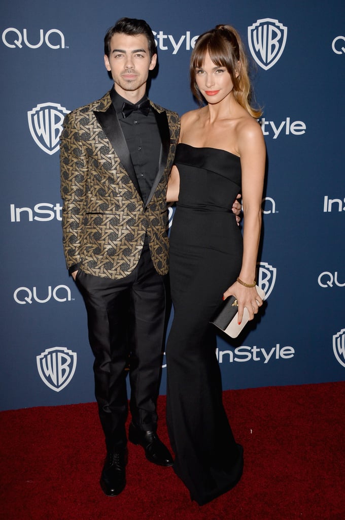 Joe Jonas and his girlfriend, Blanda Eggenschwiler, posed together as they arrived for the party.