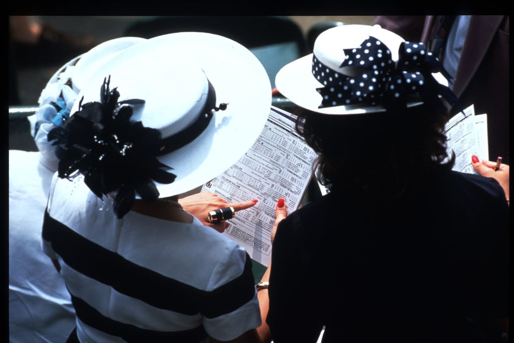 Women looked at racing tip sheets on May 6, 1995.