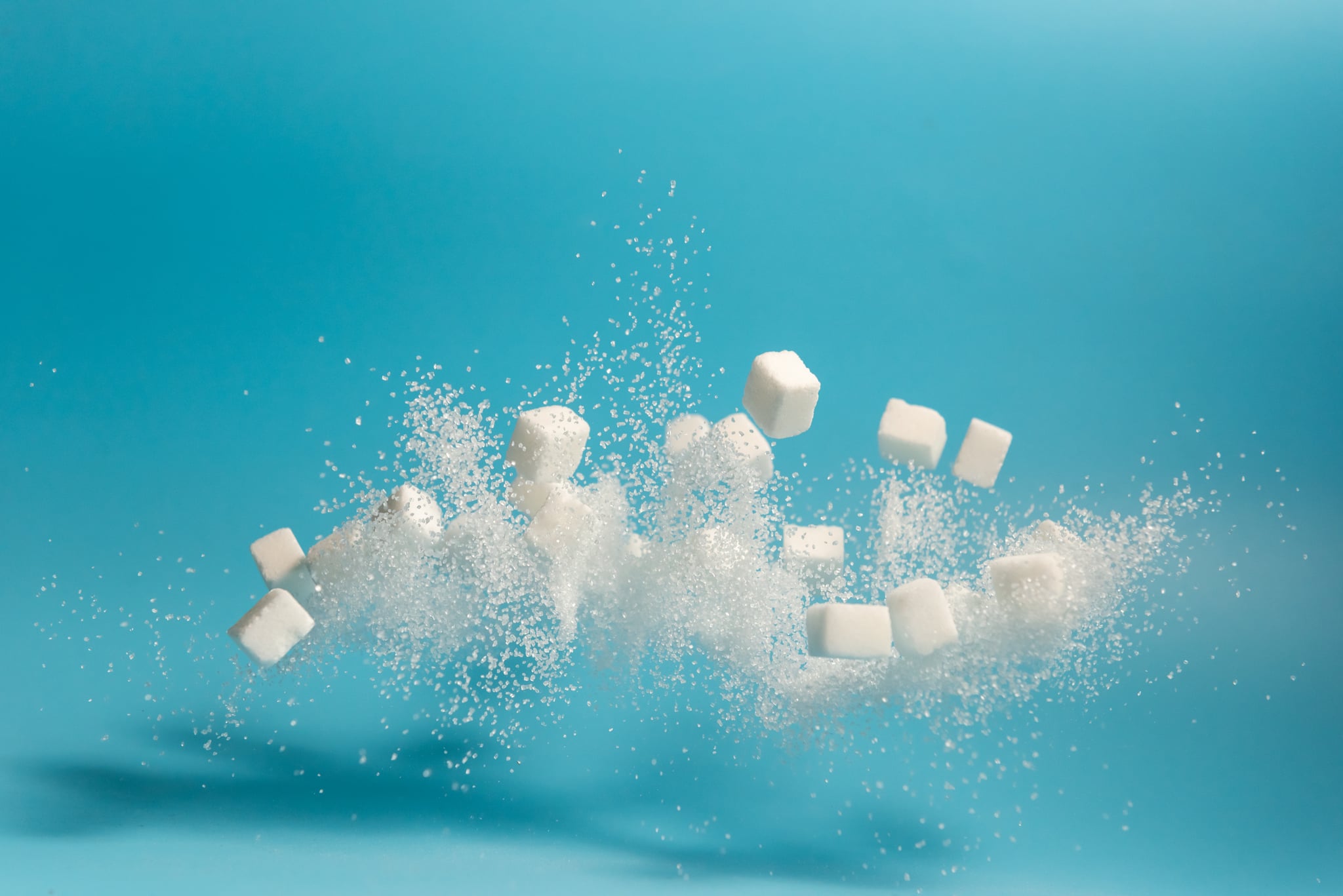 Falling sugar cubes and sugar to symbolize artificial sweetener: is it bad for you?