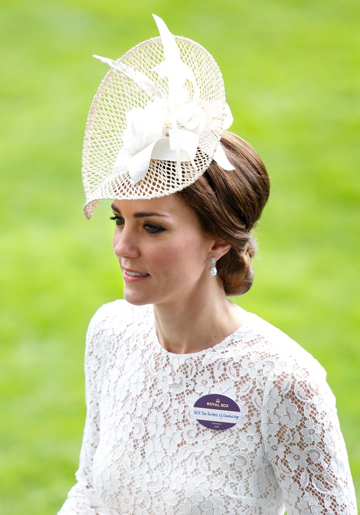 For Kate's first day at Ascot, she teamed her white lace Dolce & Gabbana dress with pearl drops, set with an aquamarine and diamonds. They are believed to be from Robinson Pelham, who designed her wedding earrings.