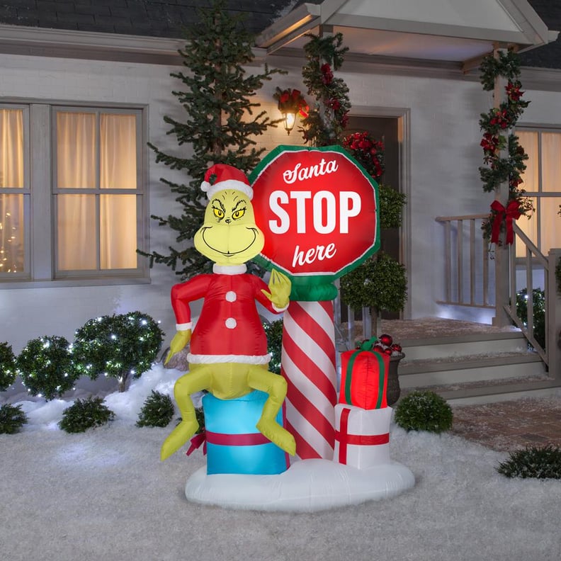 6 ft. Pre-Lit Inflatable Airblown Grinch With Santa Stop Here Sign Scene