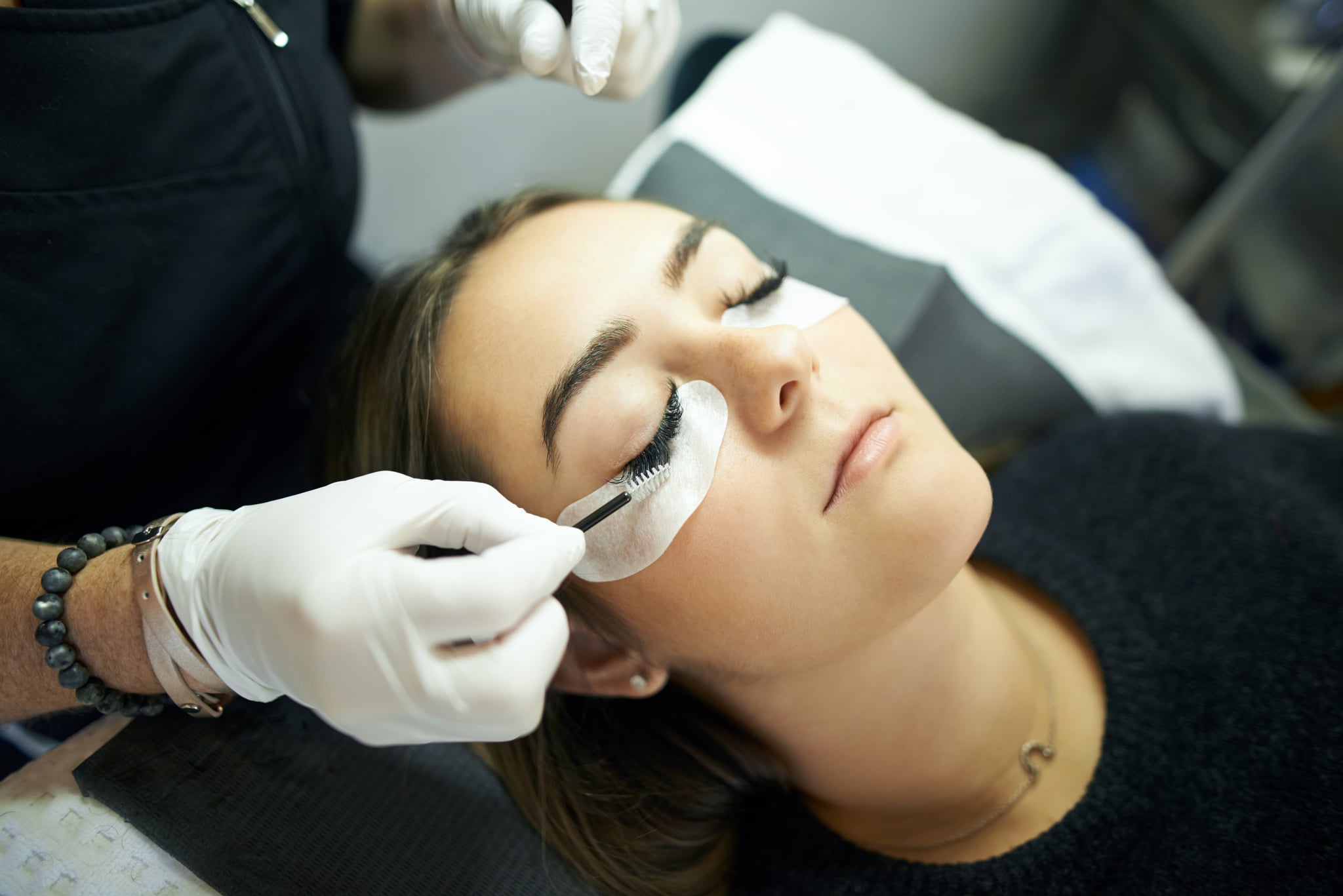 Cropped shot of a young woman getting eyelash extensions