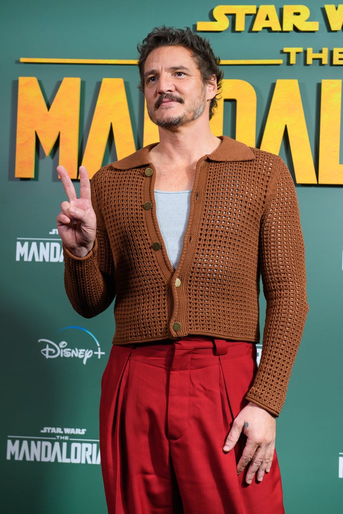 Pedro Pascal's Brown Knit Cardigan and Red Pants