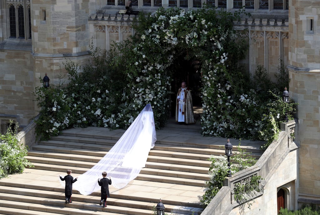 The veil is made from silk tulle and required the assistance of two pageboys to make it up the church steps.