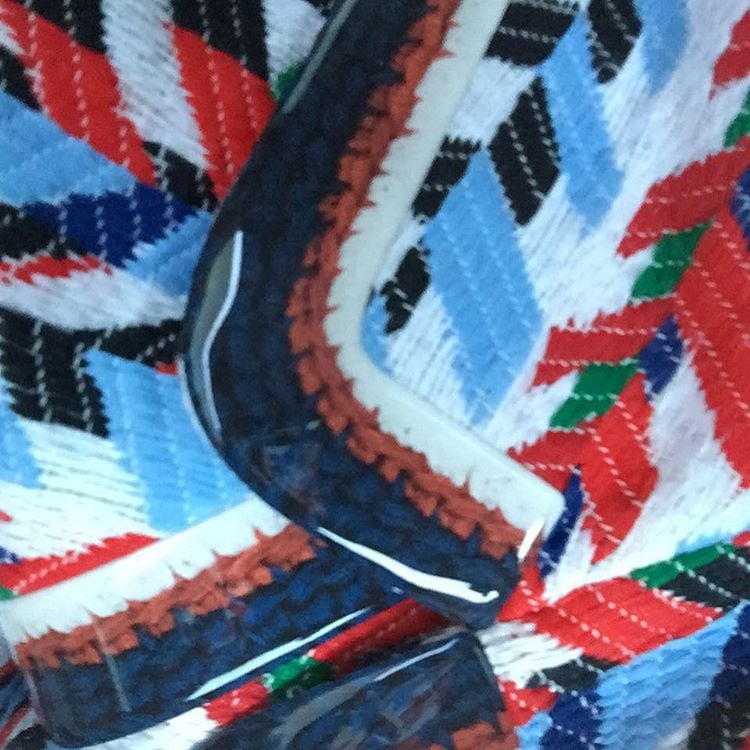 The star uploaded a photo of the suit's details, captioning the photo with a French flag emoji.