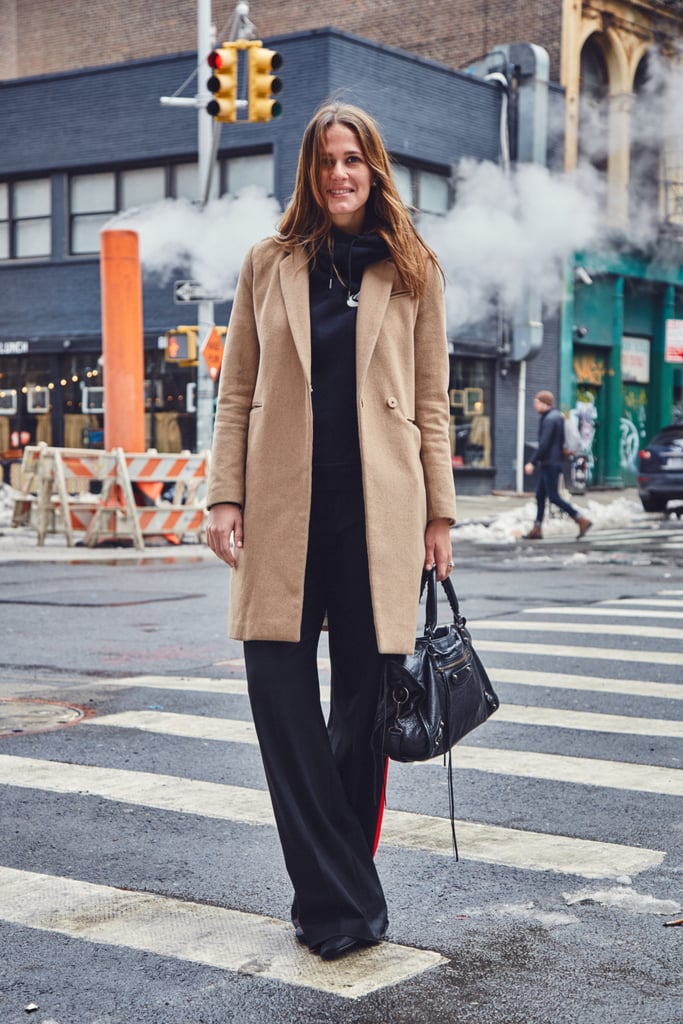 On Fashion Director Hannah Weil McKinley: H&M coat, Nike hoodie, Zara pants, and Balenciaga bag