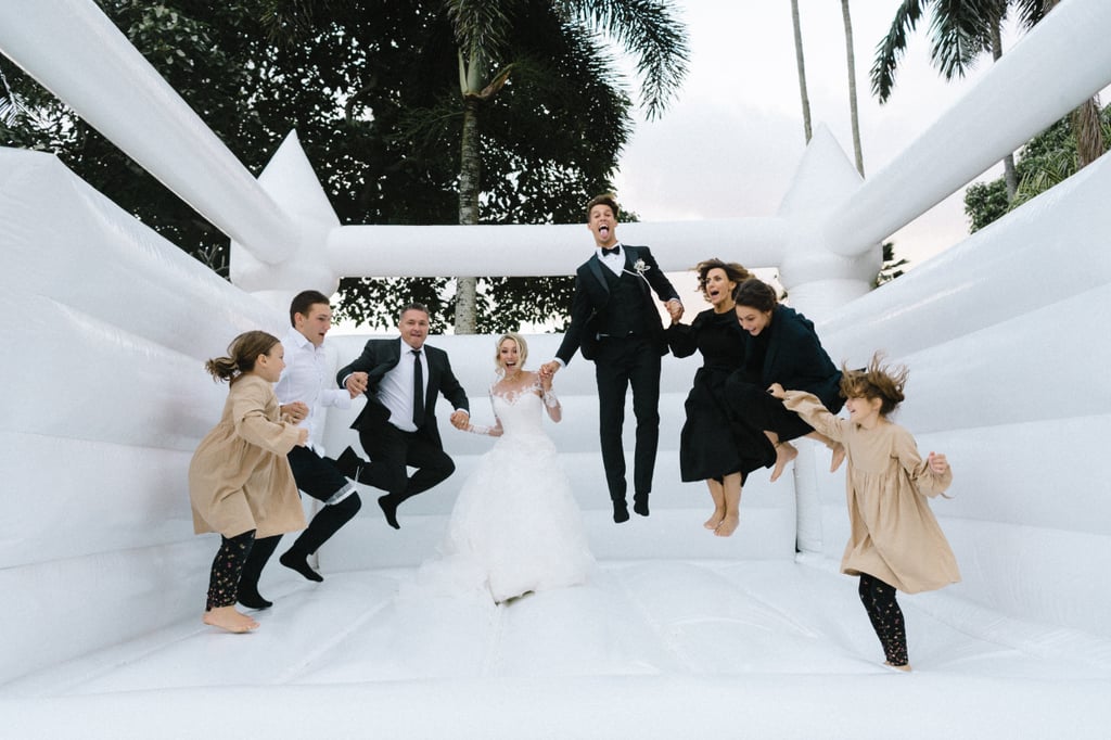 Couple Takes Wedding Photos in Bouncy Castle