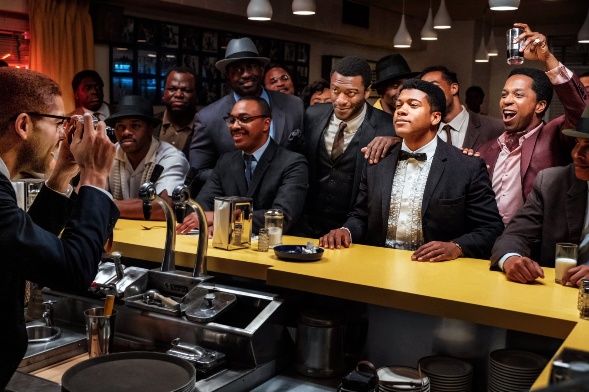 ONE NIGHT IN MIAMI, beginning at centre from left: Aldis Hodge as Jim Brown, Eli Goree as Cassius Clay, Leslie Odom Jr. as Sam Cooke, 2020. ph: Patti Perret /  Amazon / Courtesy Everett Collection