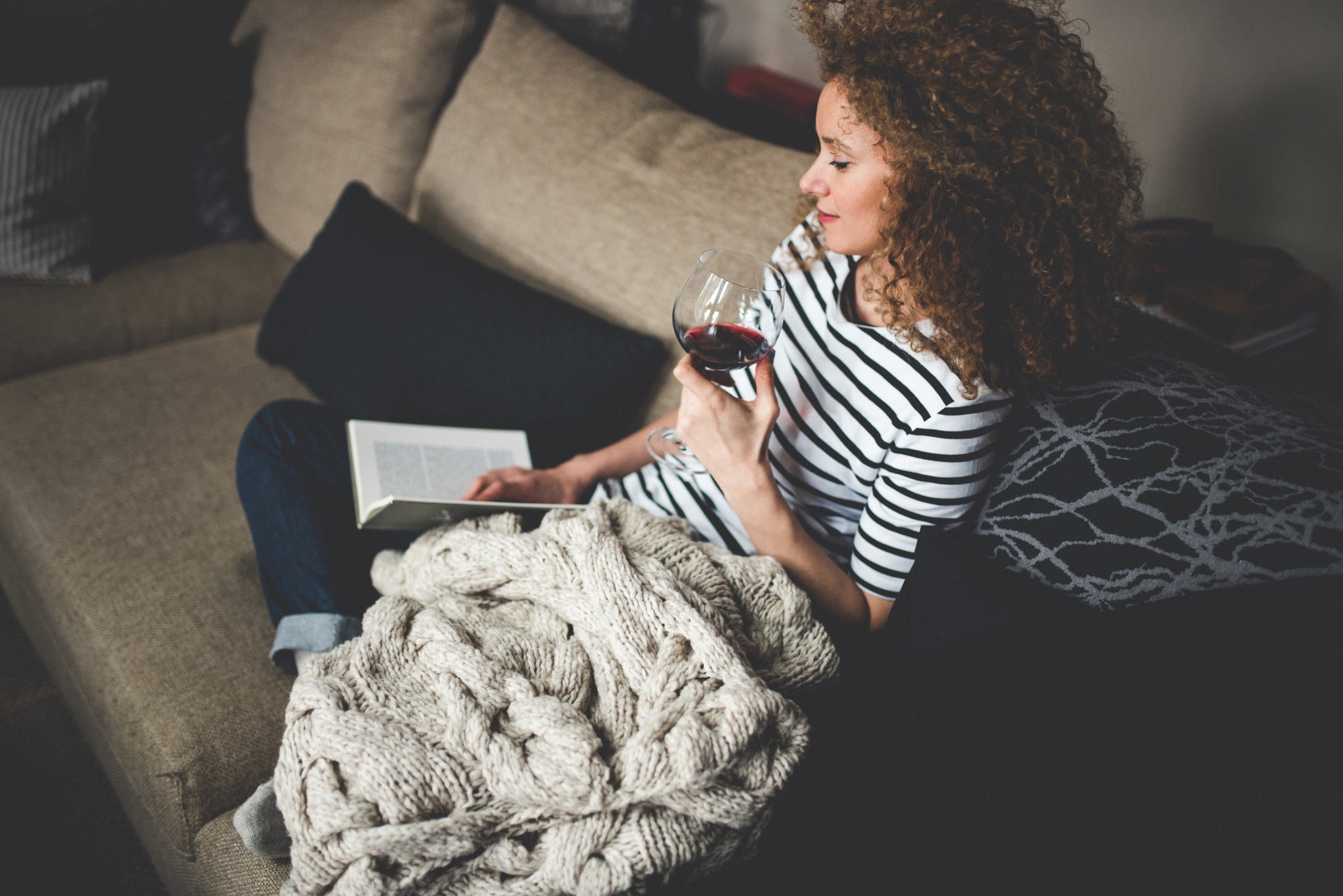 Relaxed young woman reading a book