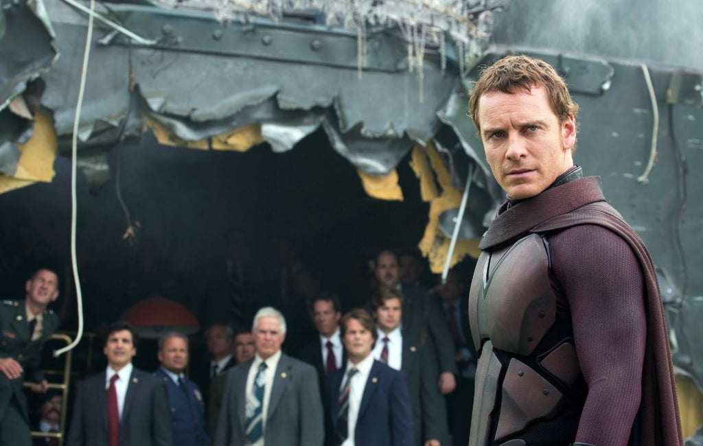 Magneto stands in the midst of wreckage.