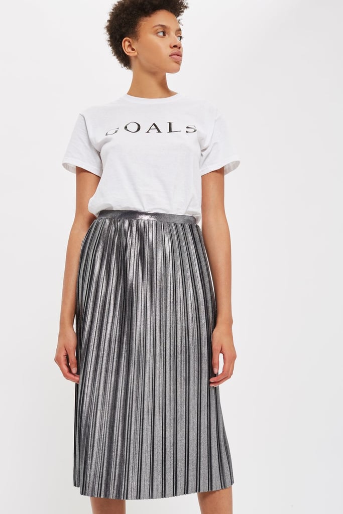 If an anorak or jacket seems like it might be too loud for you, give the Topshop Metallic Jersey Pleated Skirt ($65) a try.