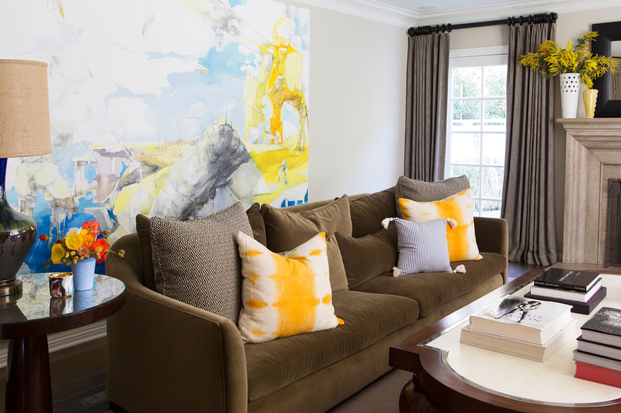 The Living Room Mixes Sophisticated Art And Accents Such As A