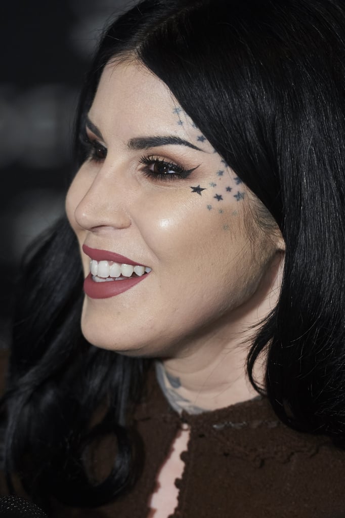 We're pretty sure only a tattoo artist can pull off the stars on the left side of her face — but you might want to consider the design for another body part.
