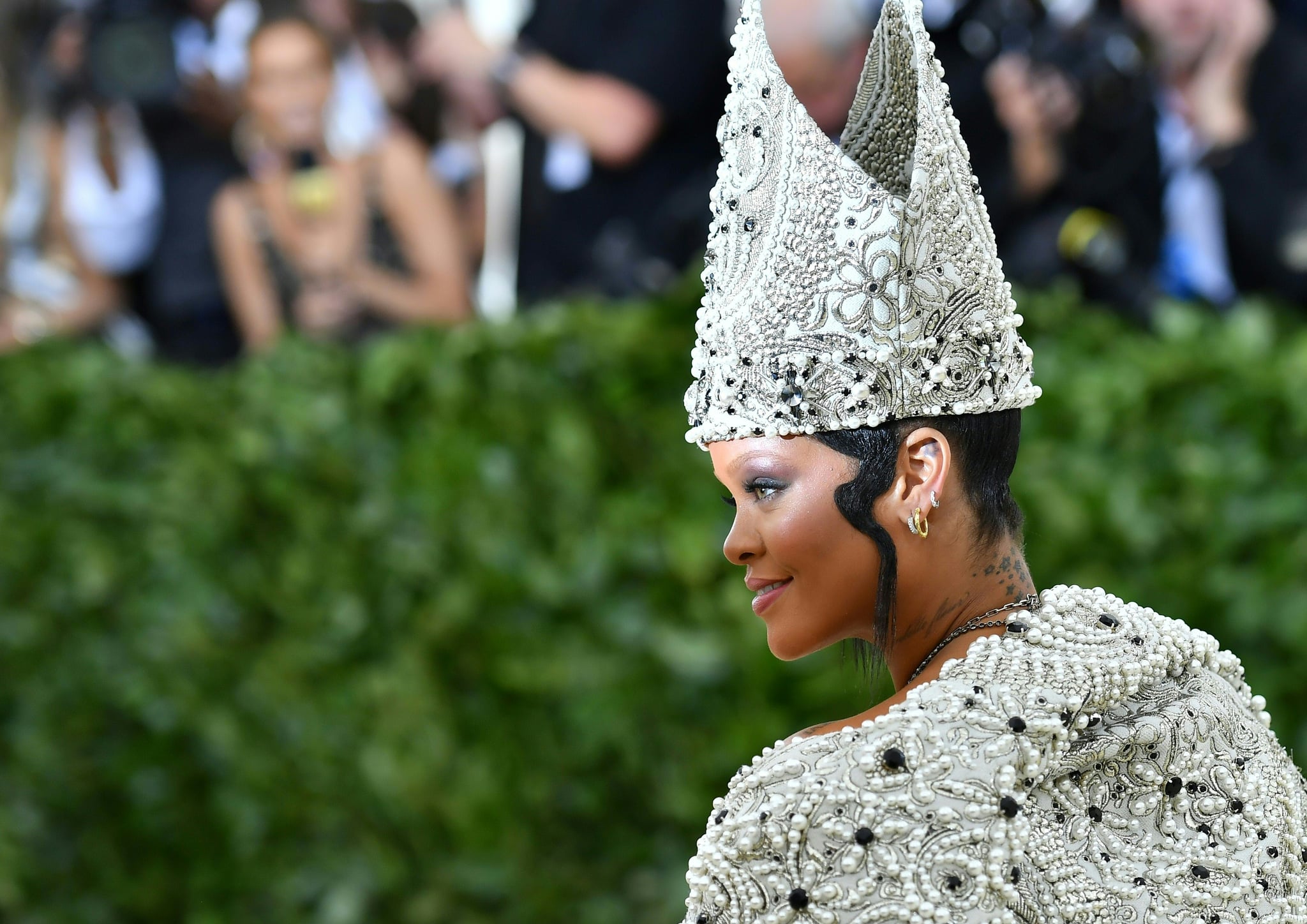 Rihanna arrives for the 2018 Met Gala on May 7, 2018, at the Metropolitan Museum of Art in New York. - The Gala raises money for the Metropolitan Museum of Arts Costume Institute. The Gala's 2018 theme is Heavenly Bodies: Fashion and the Catholic Imagination. (Photo by Angela WEISS / AFP)        (Photo credit should read ANGELA WEISS/AFP via Getty Images)