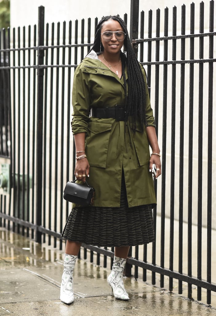 Remix a feminine pleated midi skirt with ankle boots, and your anorak belted right over it.