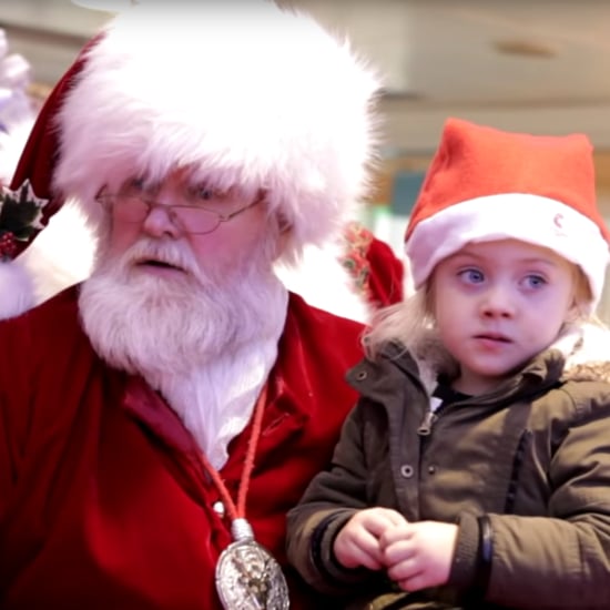 Santa Signs to Little Girl