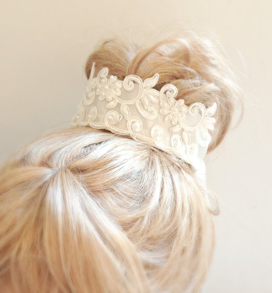 Fans of Downton Abbey will love this beautiful lace bun wrap ($39) with ivory pearls sewn on. The wrap works with or without a veil as the bow would hide the veil comb.