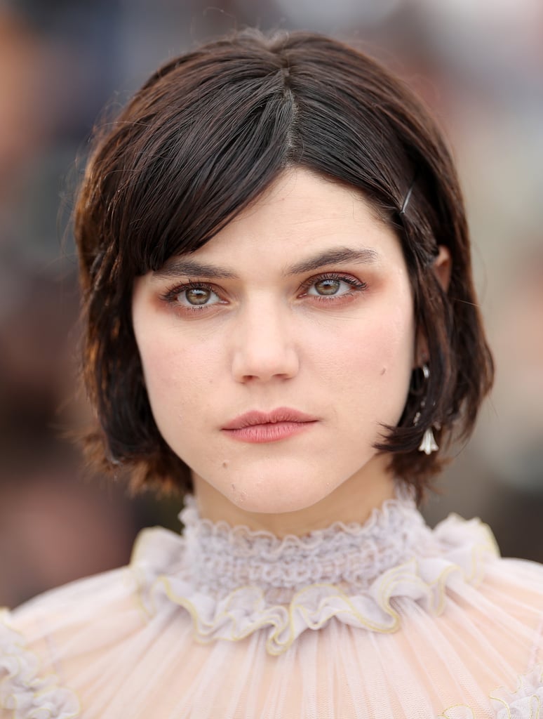 French singer and actress Soko wore a light base with her bob pinned back at the ears at The Dancer photocall.