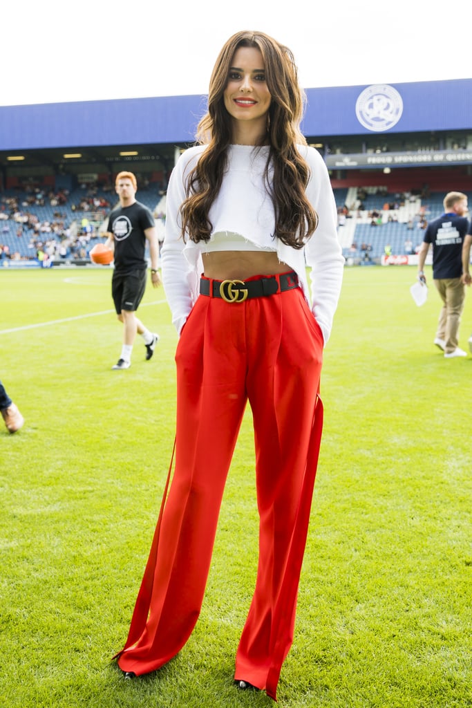 Putting in an appearance at the #Game4Grenfell charity football match, Cheryl teamed a cropped blouse with red Givenchy trousers and a Gucci belt.