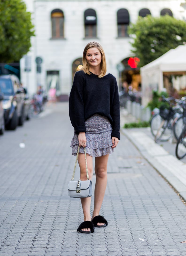 Keep a Dressy Skirt Casual With an Oversize Sweater and Slides