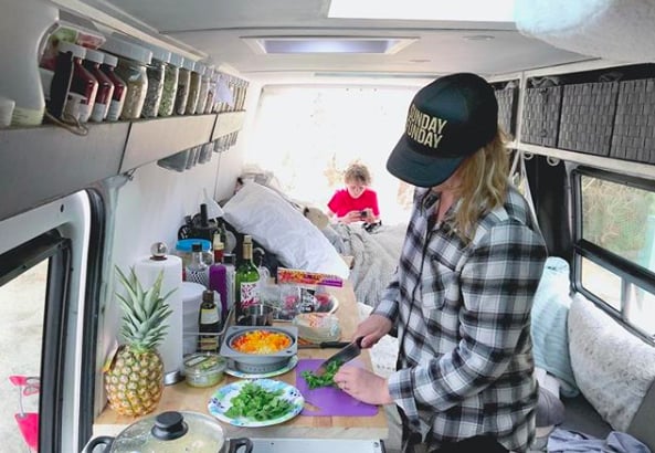 As for actually cooking? This mama made sure she had plenty of room to work. After all, no one likes a cramped kitchen, right? 
"Our kitchen counter has an extremely large footprint to accommodate a 95-liter fridge-freezer," said Tracy. "The van is powered with 260-watt solar panels. There's a stationary panel on the top and a mobile that we chase the sun with."