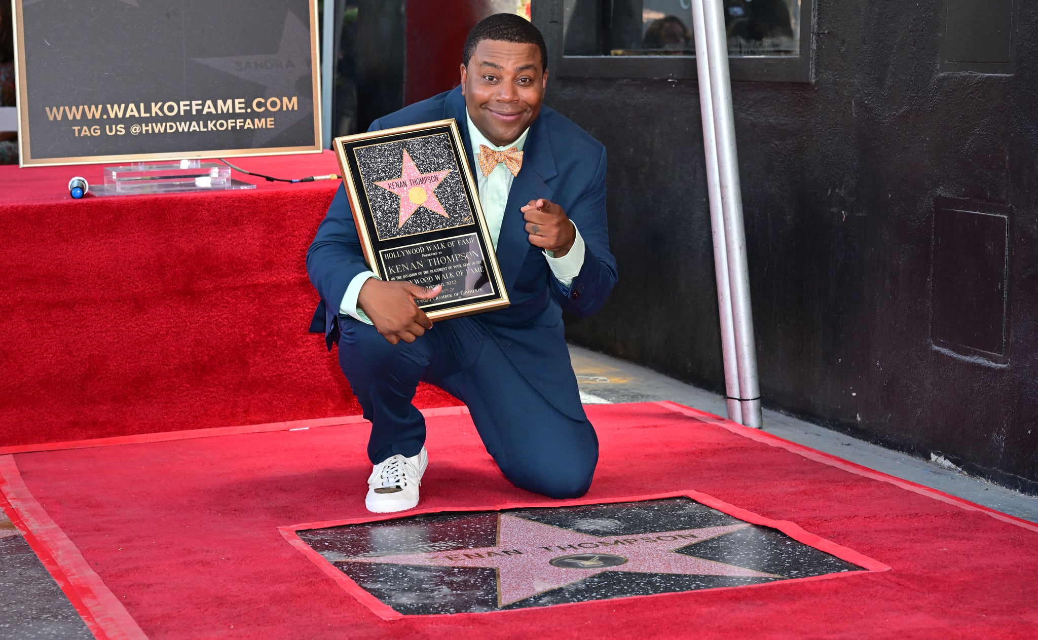 Comedian and actor Kenan Thompson poses on his just unveiled Hollywood Walk of Fame Star on August 11, 2022 in Hollywood, California. - Thompson's distinction will make him the 2,728th star in the Hollywood Walk of Fames television category. (Photo by Frederic J. BROWN / AFP) (Photo by FREDERIC J. BROWN/AFP via Getty Images)