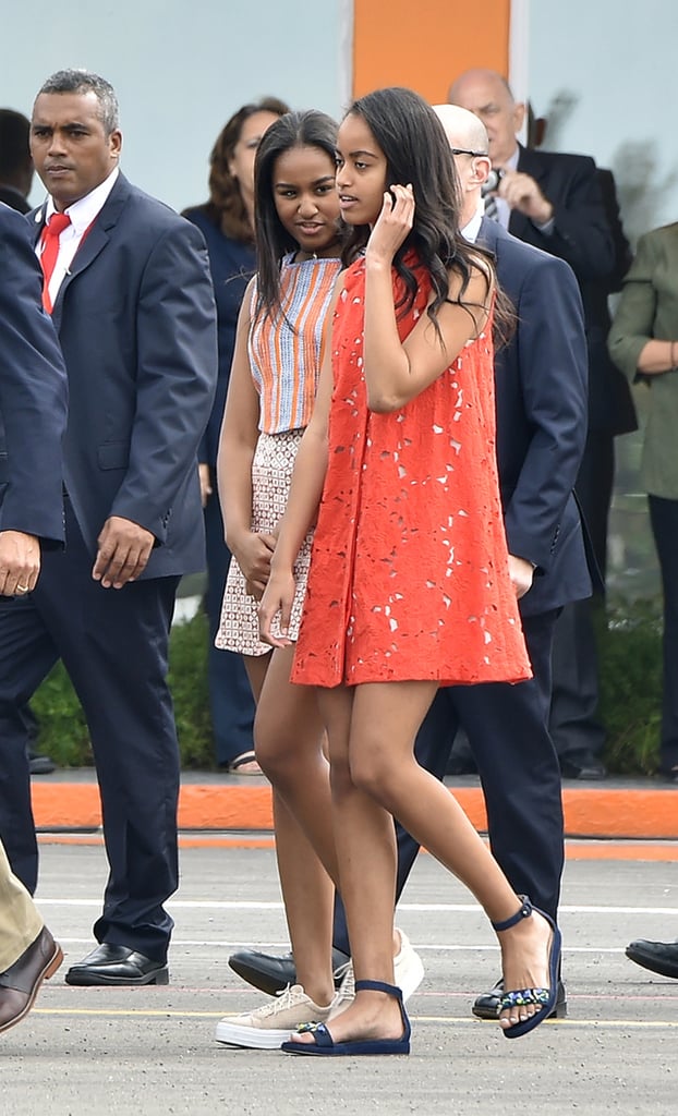 Wearing a tangerine Alice + Olivia dress in Cuba.