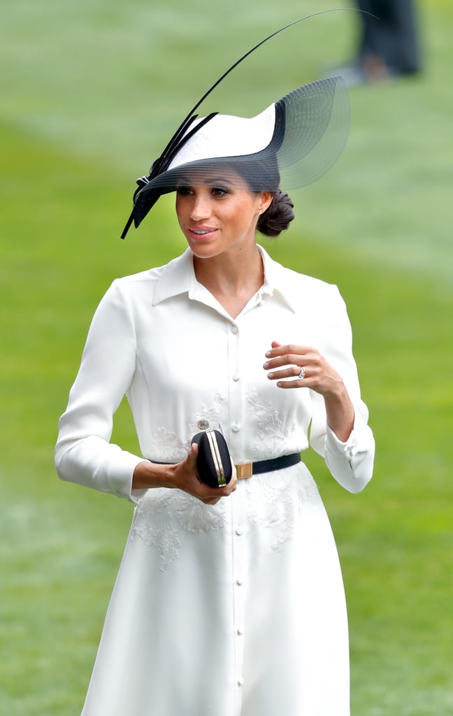 While attending her first Royal Ascot in 2018, Markle made a regal debut in a monochrome outfit, which featured a white Givenchy shirtdress and an eye-catching black-and-white hat by Philip Treacy.