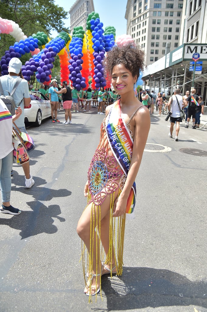 Indya Moore wearing a bejeweled dress and large crystalized hoops.