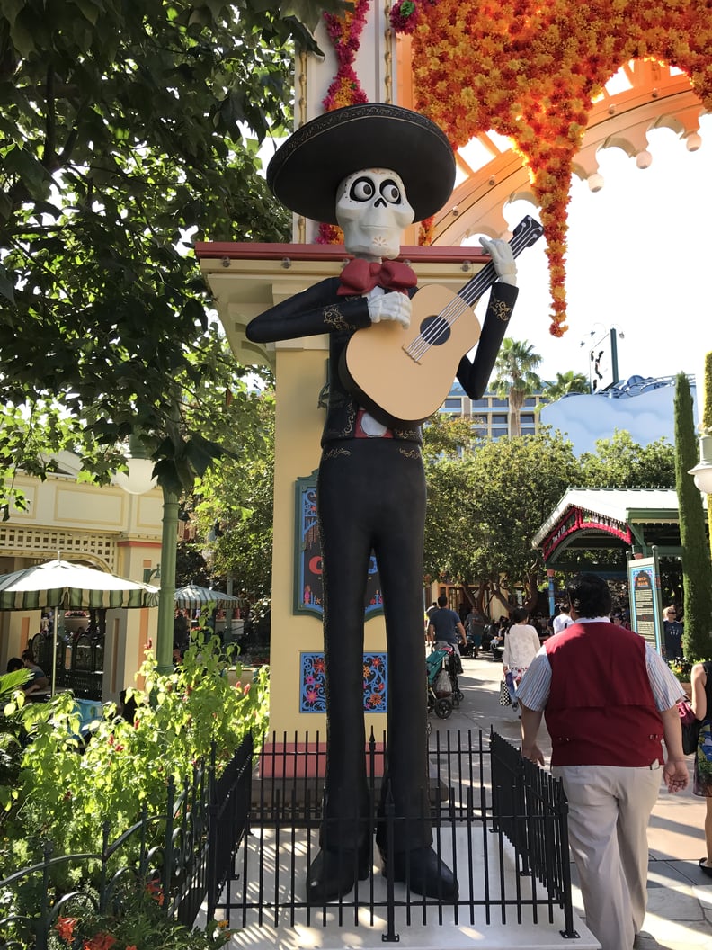 The entrance is flanked by a Catrina mariachi on one side . . .