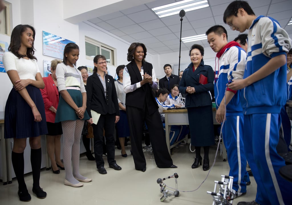 Students showed Michelle, Malia, and Sasha remote-controlled mechanical robots.