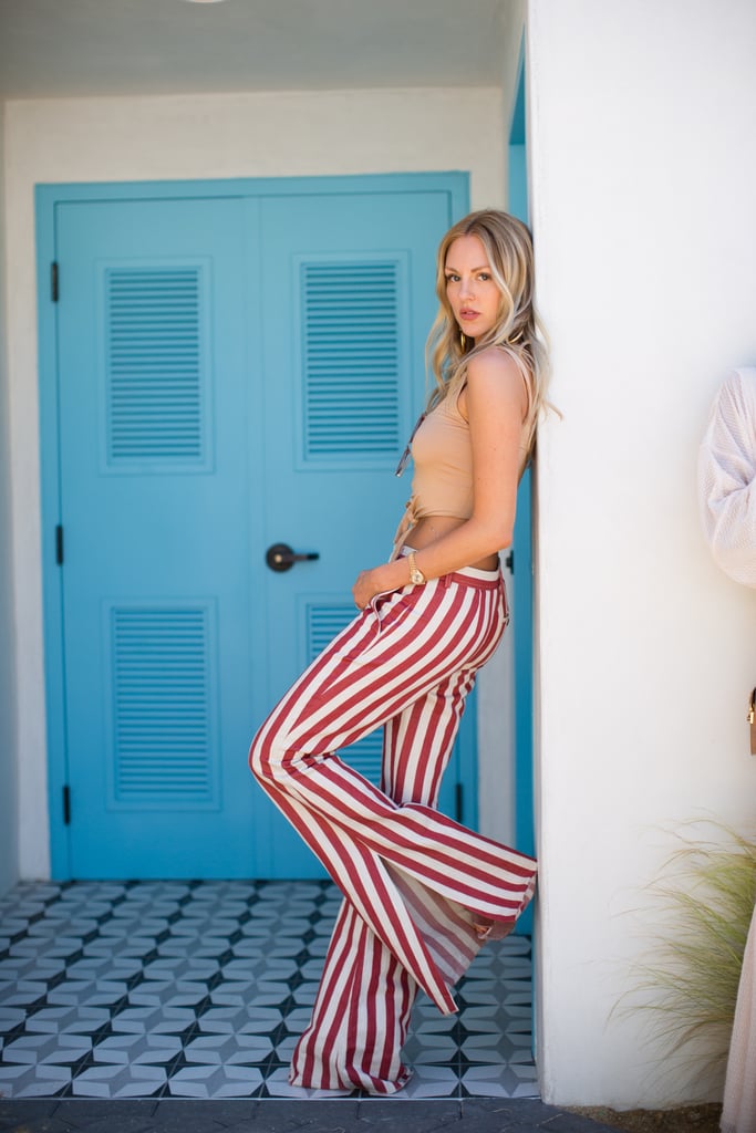 Shea Marie made a statement in striped flares and a crop top at the House of Harlow 1960 x Revolve brunch. 