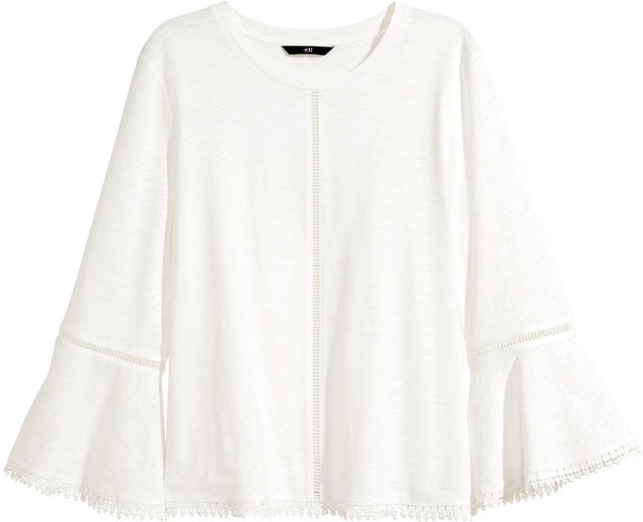 Dress up jeans or get date-night ready by pairing this flowy top with a party-ready miniskirt.
Top with Hemstitch Embroidery ($25)