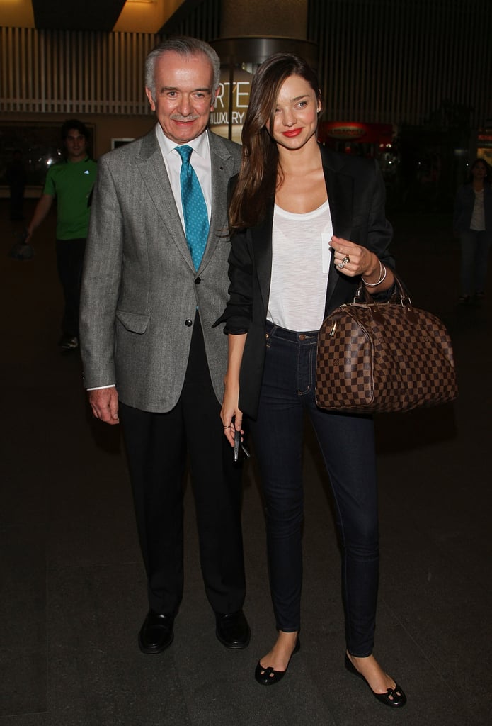 Miranda Kerr looks chic in a brown blazer with Louis Vuitton bag