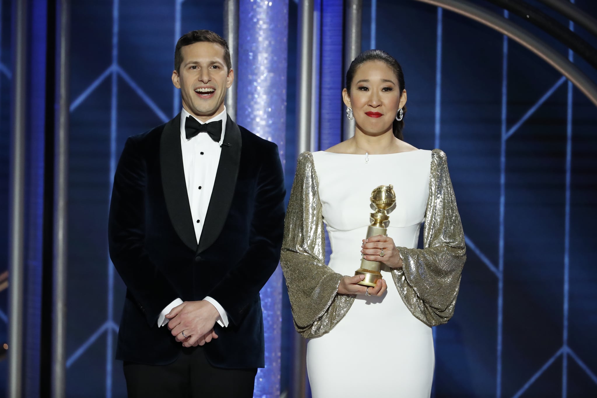 BEVERLY HILLS, CALIFORNIA - JANUARY 06: In this handout photo provided by NBCUniversal,  Hosts Andy Samberg and Sandra Oh speak onstage during the 76th Annual Golden Globe Awards at The Beverly Hilton Hotel on January 06, 2019 in Beverly Hills, California.  (Photo by Paul Drinkwater/NBCUniversal via Getty Images)