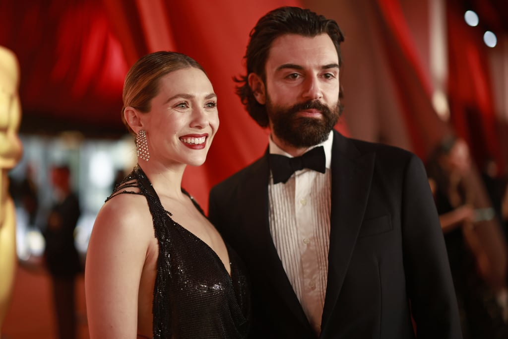 Elizabeth Olsen and Robbie Arnett at 2023 Oscars