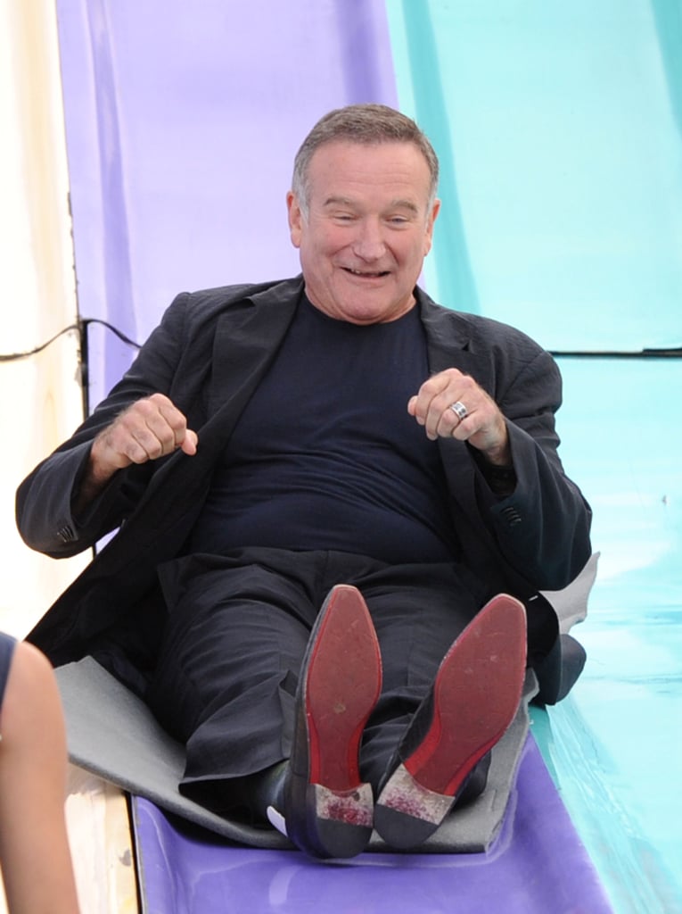 Robin got playful on a giant slide at the LA premiere of Happy Feet Two in November 2011.